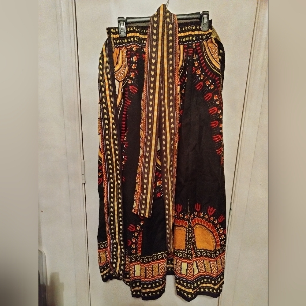 Vintage African print skirt with belt and elastic waist.